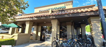 the front of a building with bikes parked outside